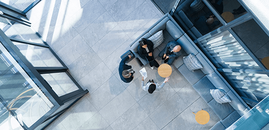A woman standing in front of whiteboard filled with information
