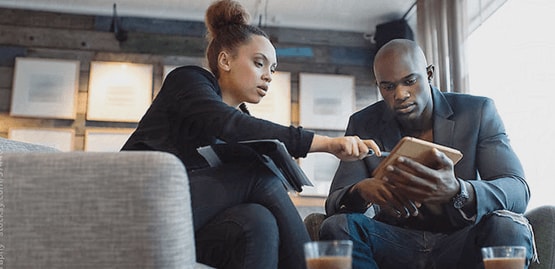 A broker gives advice to a client