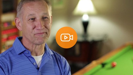 An Economical customer standing in front of his pool table