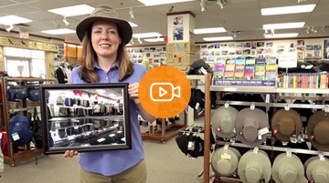 An Economical customer hold a picture of her flood damanged store