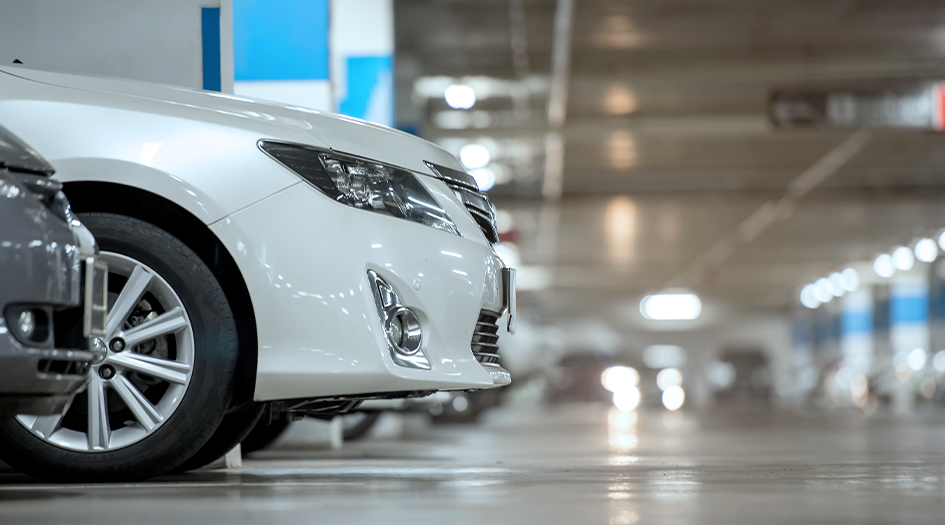 The front of a white sedan parked in an underground parking lot shows some of the most stolen vehicles in Canada.