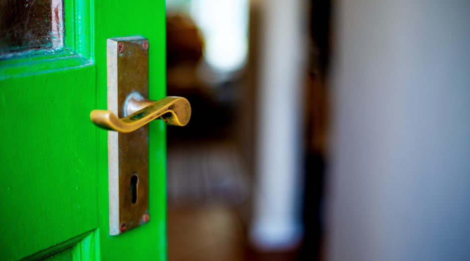 A green door sits slightly open, showing what you should do if your house has been broken into