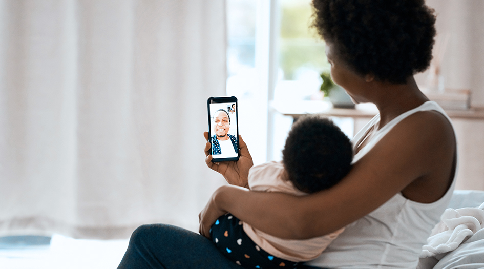 Here’s what you need to know about insurance coverage for your mobile phone, shown by a woman and baby video calling on her phone
