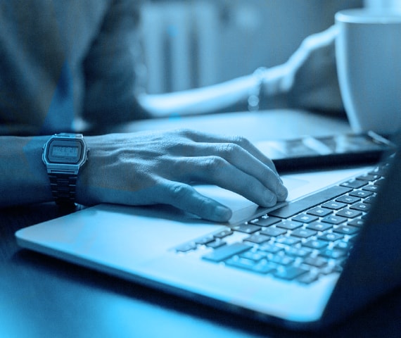 hands on a laptop computer