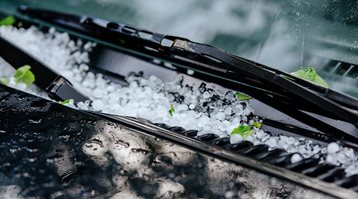 Here is how to protect your car from hail damage, like the hail collected on this car's windshield