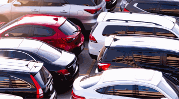 A variety of cars parked in a parking lot show some of the most stolen vehicles of 2023.